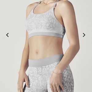 Fabletics burgundy damask sports bra and leggings.